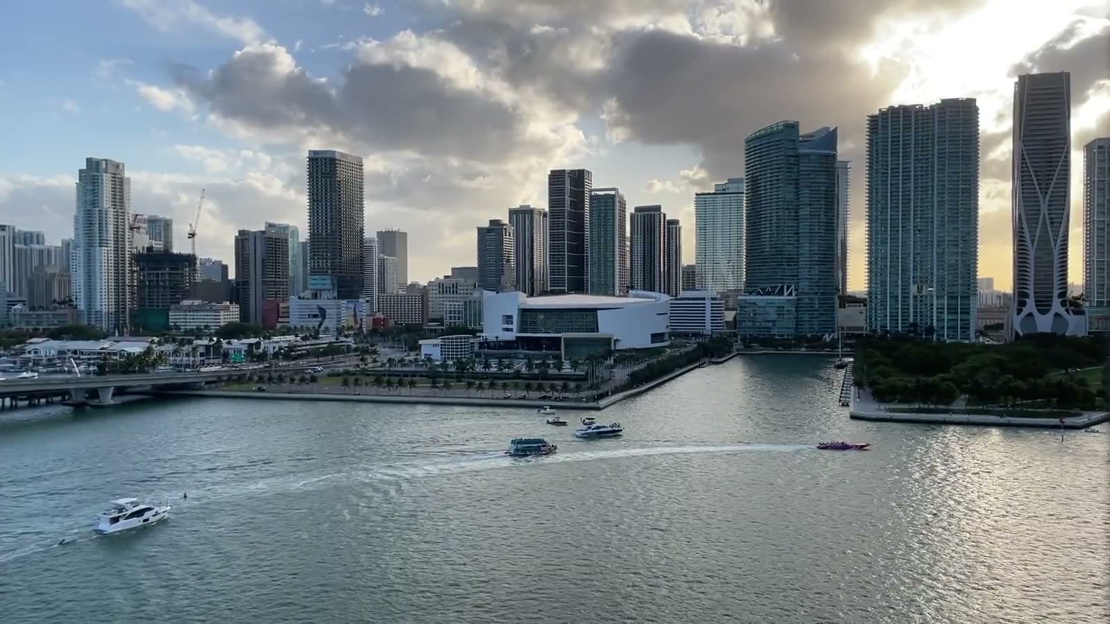 Boats crossing Biscayne Bay in front of downtown Miami in the late afternoon