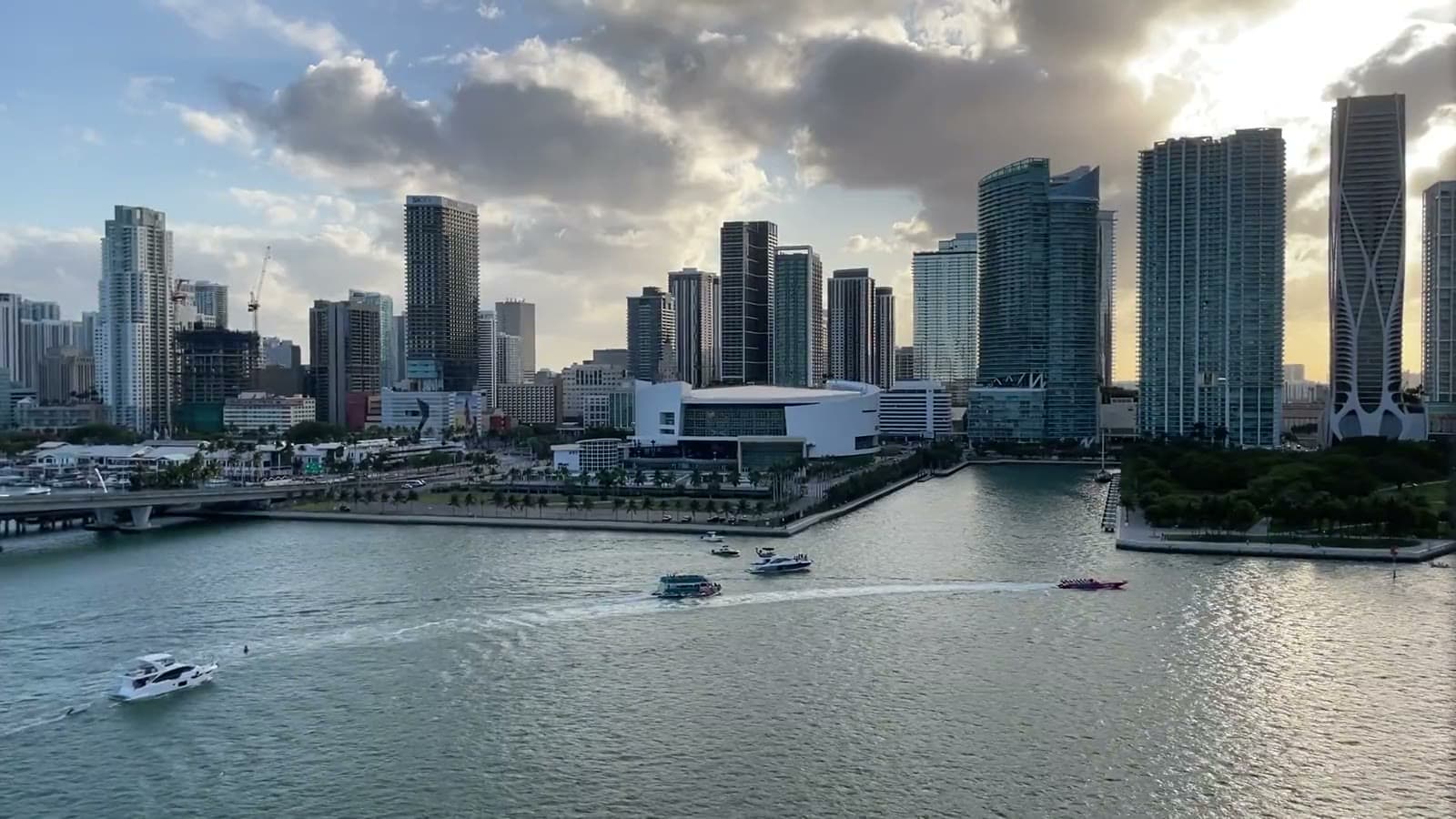 Boats crossing Biscayne Bay in front of downtown Miami in the late afternoon